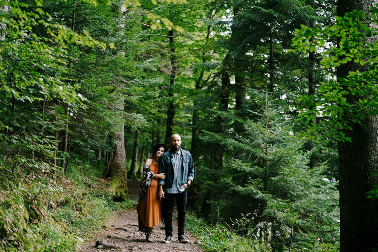 Man and woman walking in forest