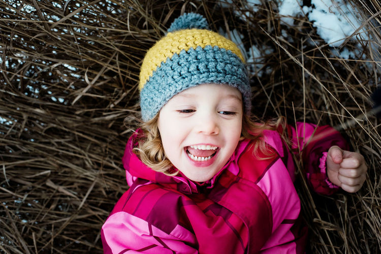 Portrait of a smiling girl in snow