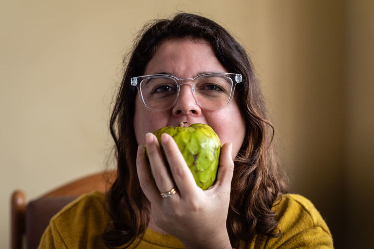 Portrait of woman holding food
