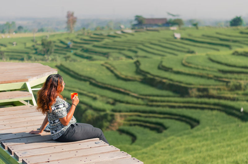 Woman sitting on farm