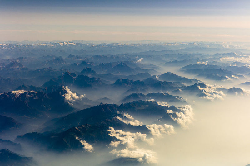 Aerial view of mountains against sky during sunrise