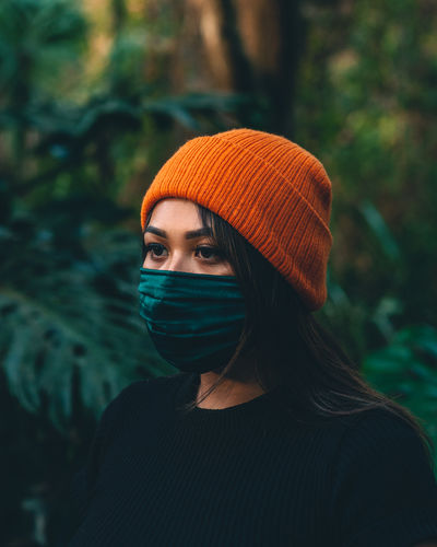 Portrait of young woman in orange hat