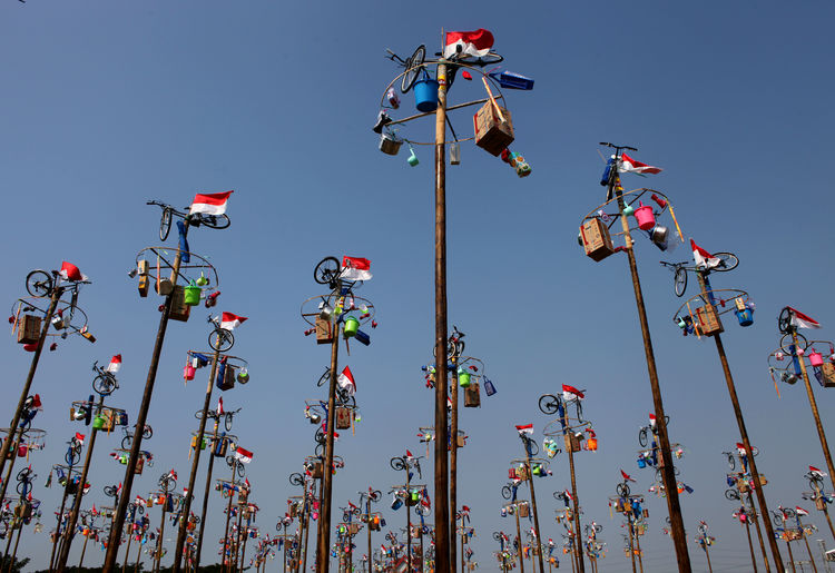 Low angle view of colorful decorations against clear sky