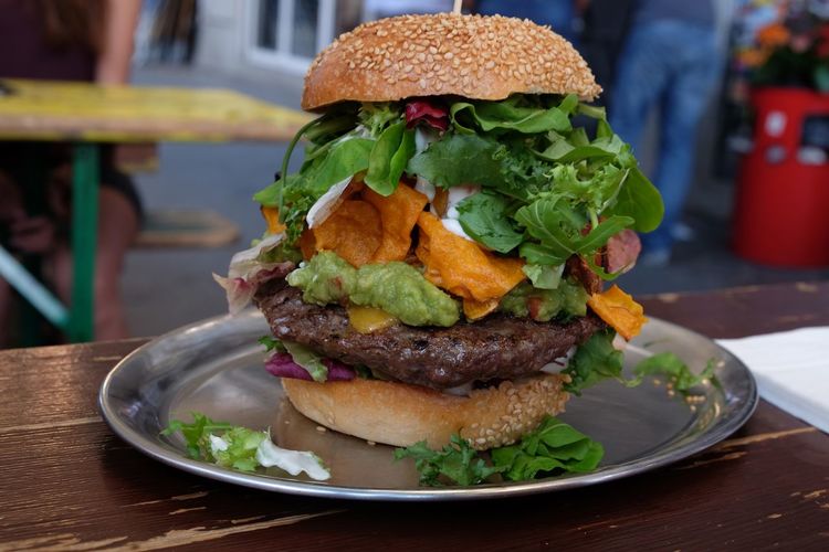 Close-up of burger on plate at table