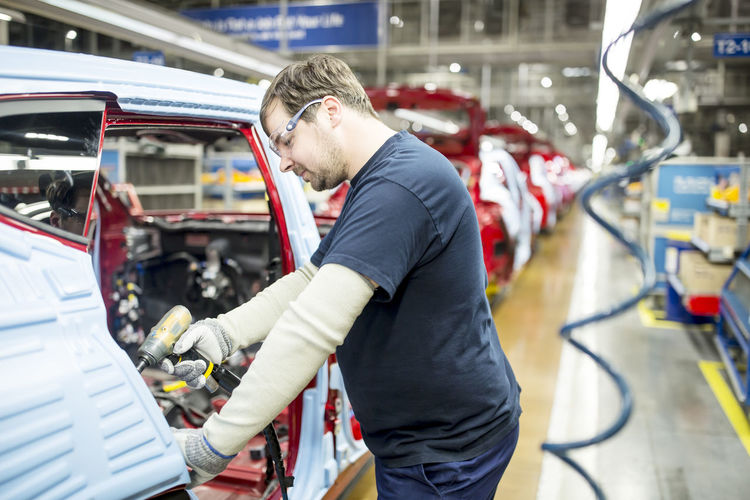 Man working in modern car factory