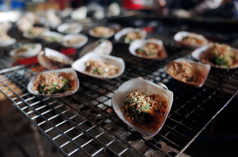 Close-up of clams on barbecue grill