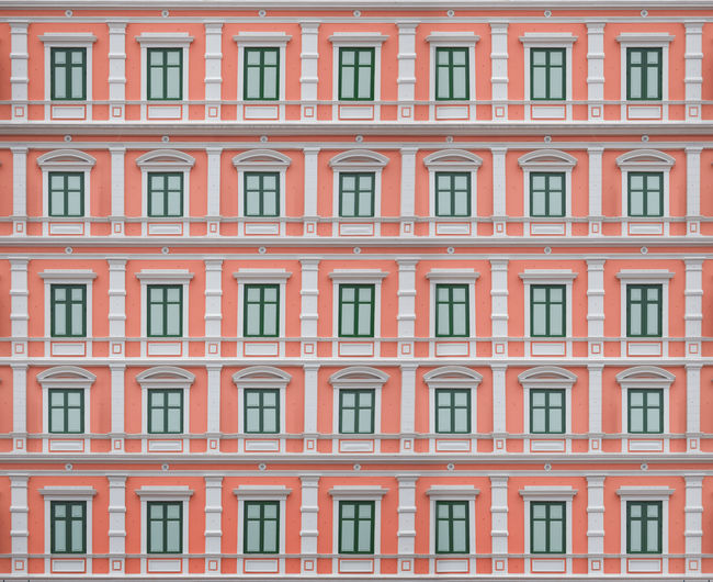 Exterior building with closed window on cement wall for background