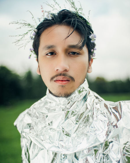 Portrait of young man wearing futuristic outfi