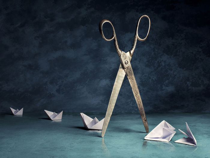 Paper boats tale with scissors