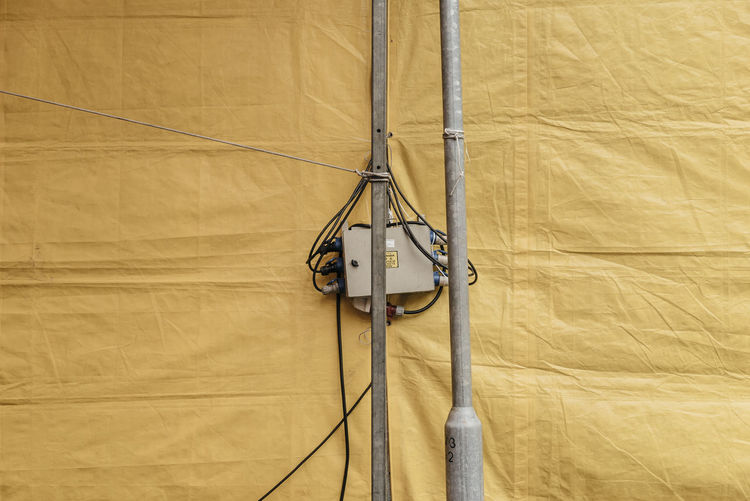 Electrical equipment on pole by tent