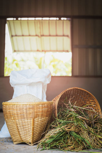 Thai organic raw jasmine rice in bamboo basket.