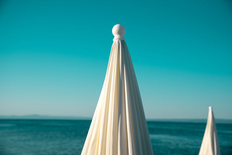 View of white beach umbrella