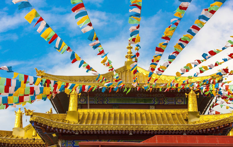 Buddhist praying flags near the monastery in sanya, china