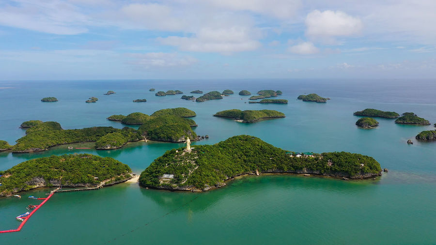 Cluster of small islands in hundred islands national park, pangasinan, philippines. aerial drone