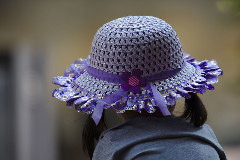 Rear view of girl wearing purple hat