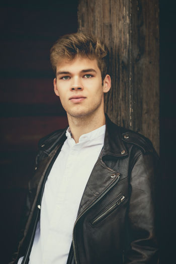 Portrait of a young man, stylish with a leather jacket