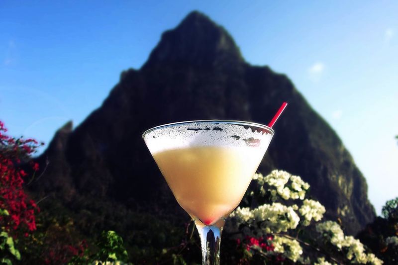 Close-up of pina colada in glass against mountain