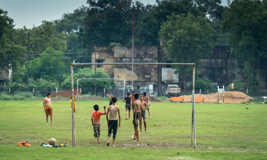 People playing soccer on field