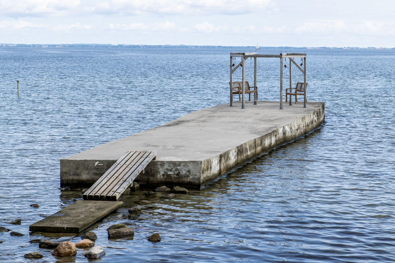 Pier over sea against sky