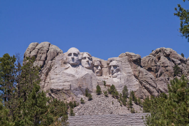 Low angle view of mt rushmore national monument against clear sky