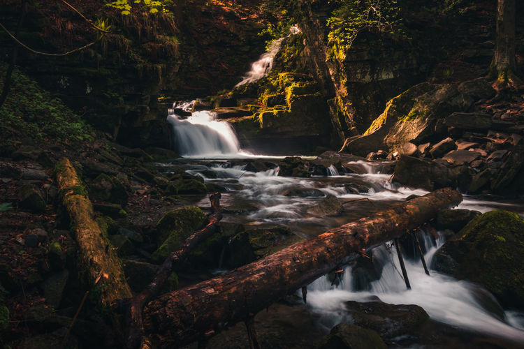 Satiny waterfalls. breathtaking, untouched nature around the water flowing down cascades 