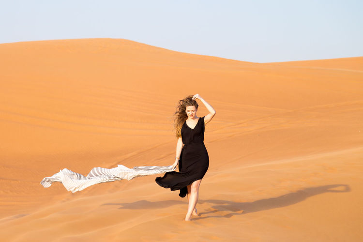 Woman walking at desert