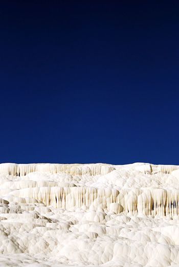 Scenic view of pamukkale against clear sky