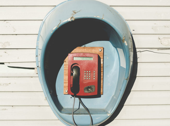 Close-up view of red telephone