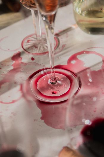 Close-up of wine pouring water in glass