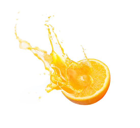 Close-up of orange fruit on white background