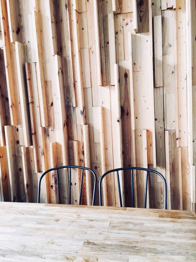 Wooden chairs against wall