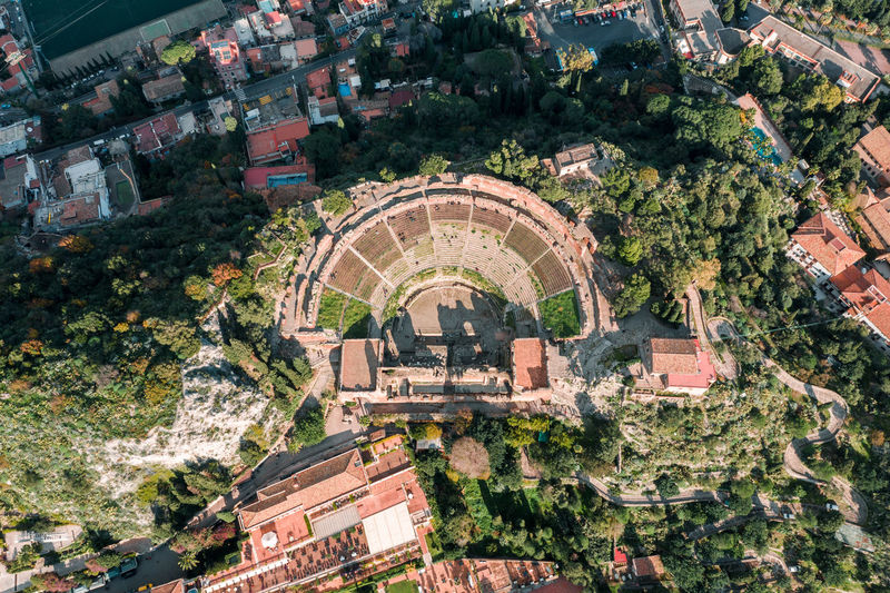 Aerial drone shot of the ancient greek theatre of taormina, theatre seen from above