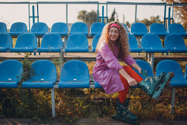 Portrait of smiling girl sitting on playground
