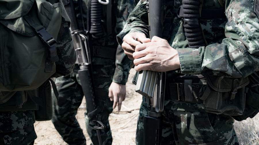 Close-up of army soldiers with rifle