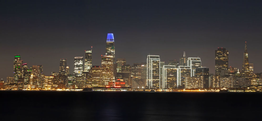 Illuminated buildings in city at night