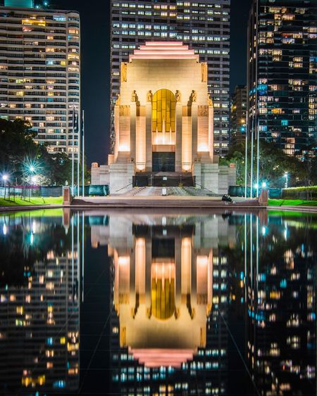 Reflection of buildings in city at night