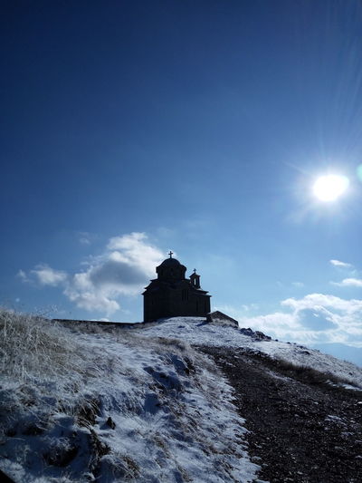 Distant view of church against sky
