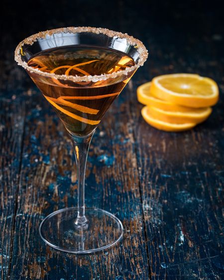 Close-up of citrus martini on wooden table