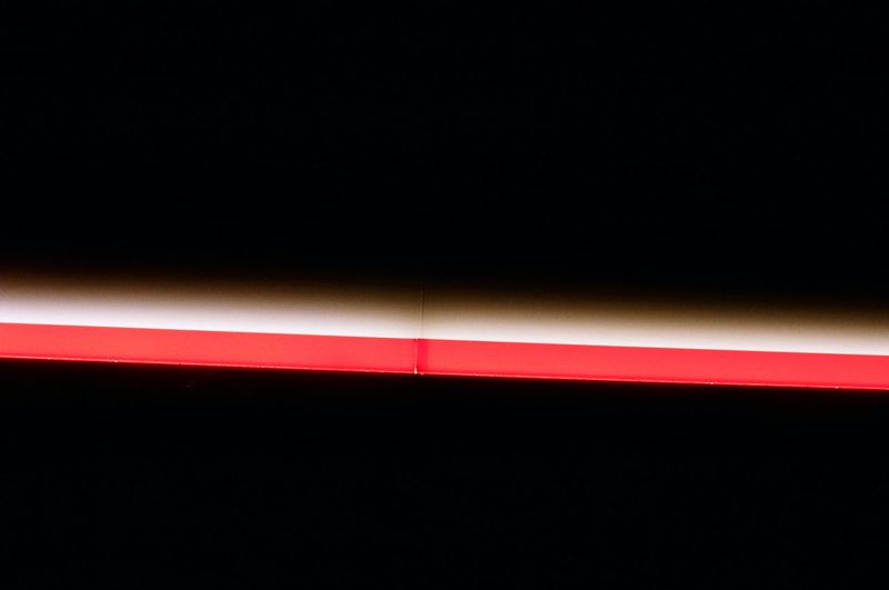 Close-up of red light at night