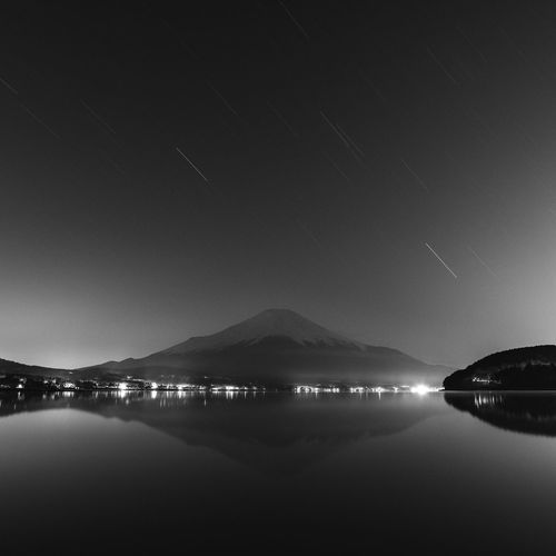 Night shot of mount fuji from lake yamanaka, yamanashi prefecture, japan