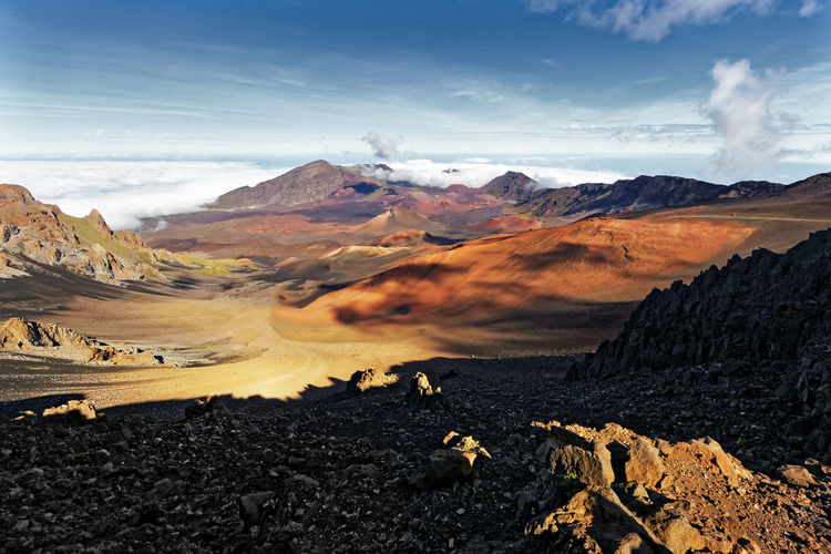 Wide volcanic landscape with lava fields in different colors, wide view, hawaii, maui, haleakala