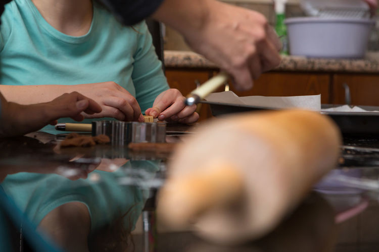 Midsection of woman making cookie