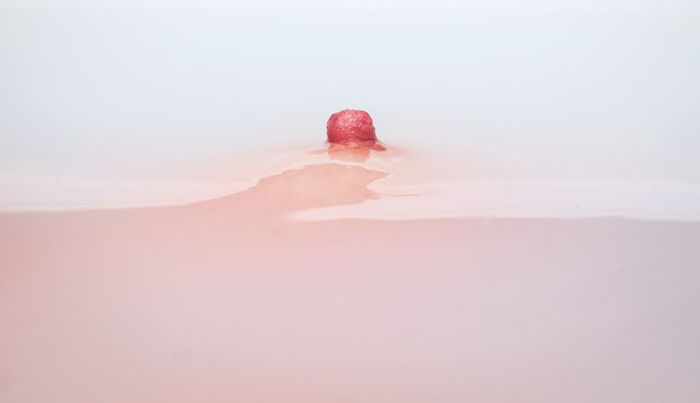 Close-up of woman nipple in bathtub