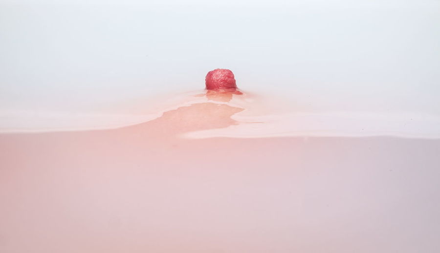 Close-up of woman nipple in bathtub