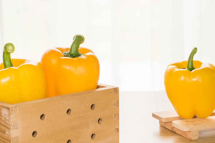 Close-up of yellow bell peppers on table