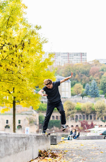 View of man skateboarding in city