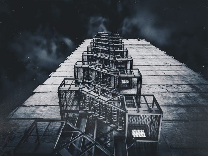 High angle view of ladder by building against sky