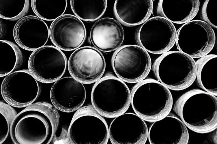 Full frame shot of stacked pipes