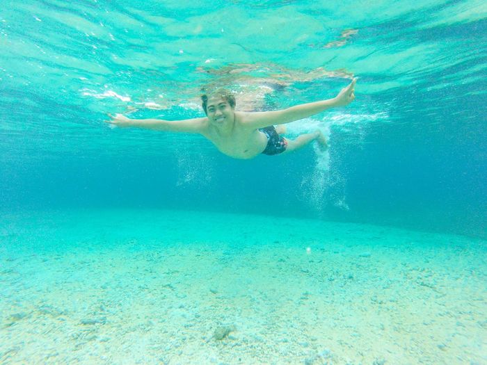 Portrait of woman swimming in sea