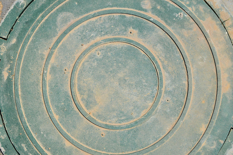 High angle view of metal manhole cover